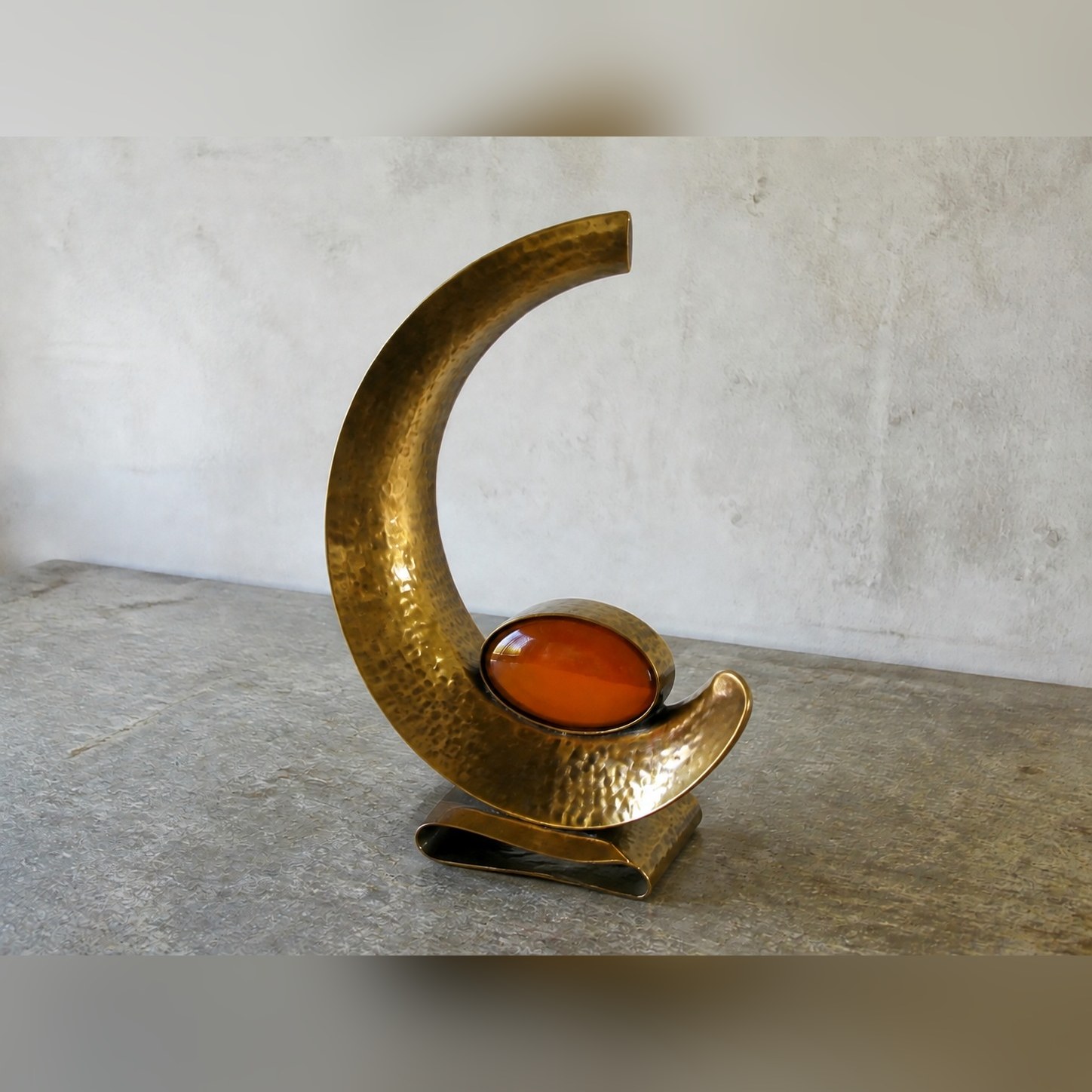 Ratan Crescent Wrap — Brass · Compact translucent amber resin oval · Antique, XANVOR, Moradabad